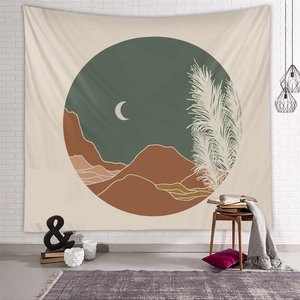 Detail of bohemian mountain tapestry hanging on white brick wall in a cozy room