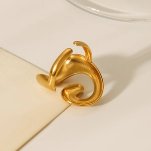 Detail shot of 18K gold plated spiral stainless steel ring with polished finish