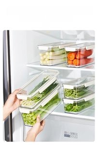 Detail of multi-layer stackable airtight food containers with secure side buckles in fridge