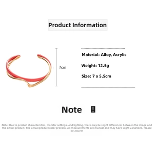 Detail of red and gold open bangle with weight and size specifications for women