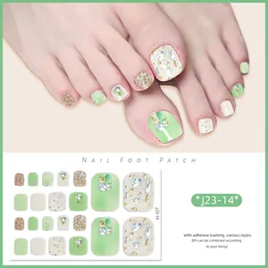 Detail of J23-14 toe nail stickers featuring mint green, gold foil, and crystal accents