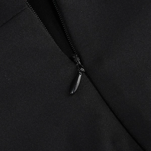 Detail of high-quality black invisible zipper and textured twill fabric on dress