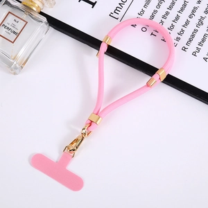 Pink adjustable nylon phone lanyard with gold metal buckle and matching connector pad