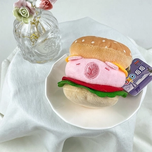 Cute hamburger pig plush keychain with soft texture and vibrant colors on white fabric