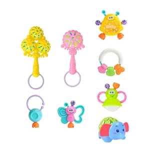 Macro view of 7-piece colorful baby rattle and teether set on white background