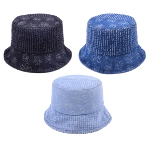 Denim bucket hat with floral jacquard print and frayed edge detail in three blue washes