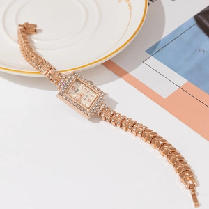 Elegant rose gold square quartz watch for women with rhinestone inlay strap on white background