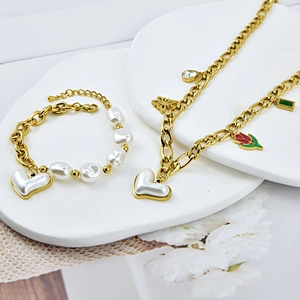 Golden chain jewelry set with white heart pendant, pearls and floral charms for women