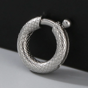 Detailed macro view of silver stainless steel spring clasp with diamond texture finish