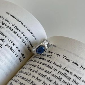 Handcrafted 925 sterling silver ring featuring an irregular texture and blue stone
