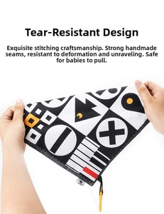 Detail of tear-resistant baby cloth book with hand-stitched edges and sensory patterns