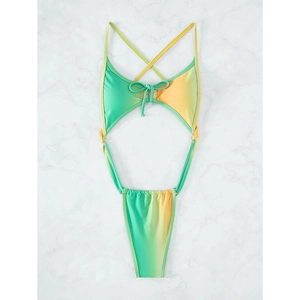 Close-up of vibrant green and yellow gradient swimsuit with waist cut-outs and lace-up