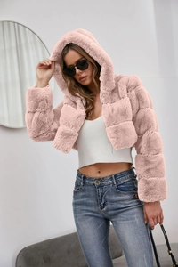 Detail of pink faux fur coat with checkered patchwork texture and hooded design