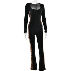 Detail showing side patterned patchwork and flared leg on black long sleeve jumpsuit