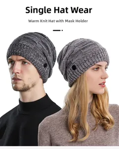 Detail of gray winter beanie showing side buttons for face mask attachment