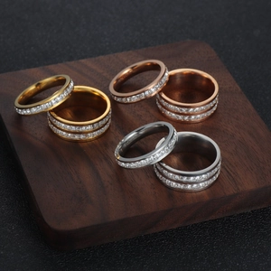 Macro display of six-piece square zircon eternity rings in gold, rose gold and silver