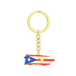 Detailed close-up of Puerto Rico map keychain with flag enamel and golden Coqui frog symbol