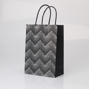 Premium black kraft gift paper bag with silver wavy zigzag pattern and rope handles
