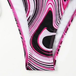 Macro detail of bikini bottom showing pink marble print and breathable white mesh lining