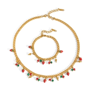 Gold stainless steel jewelry set featuring red strawberry pendants and Cuban chain links