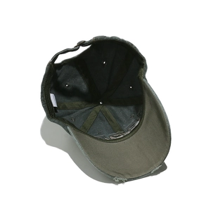 Detail of 100% cotton label and internal stitching on vintage washed baseball cap