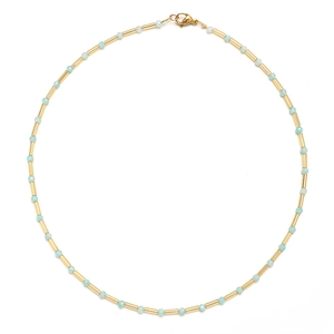 Detail of light blue beaded necklace with gold metal tubes and lobster clasp closure
