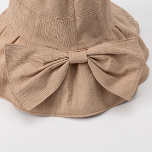 Women summer sun hat with large bow and pleated texture in camel brown solid color