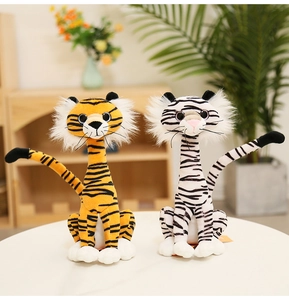 Detailed view of plush toy tigers in yellow and white fur with soft texture