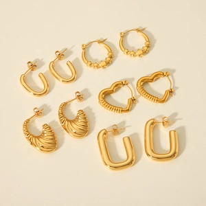 Detailed collection of golden heart, star, and geometric stainless steel earrings