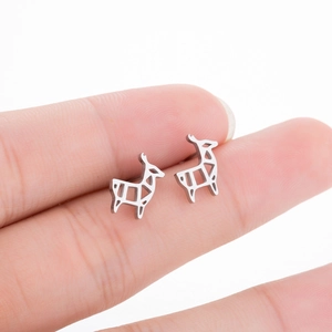 Close-up of minimalist stainless steel deer earrings with geometric cut-out lines