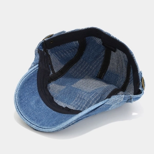 Interior detail of 100% cotton denim newsboy cap showing stitching and sweatband