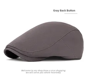 Detail of gray British vintage octagonal newsboy hat with twill cotton texture and button back