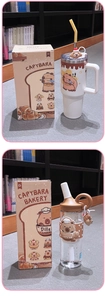 Detail of Capybara themed insulated bottle and straw cup with cute character charms