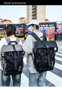 Outdoor street view of a large capacity waterproof sports backpack with roll-top design