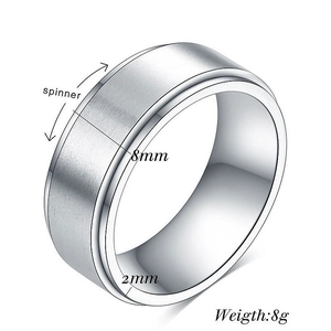 Detail view of 8mm silver spinner ring showing brushed texture and polished inner band