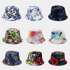 Nine reversible vintage print bucket hats showing various floral and tropical patterns