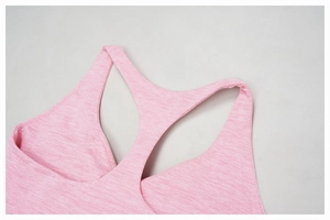 Detail of pink racerback sports bra showing high-quality brushed knit fabric and stitching
