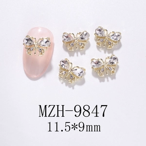 Detail of 11.5x9mm hollow gold alloy butterfly nail charms with clear rhinestones