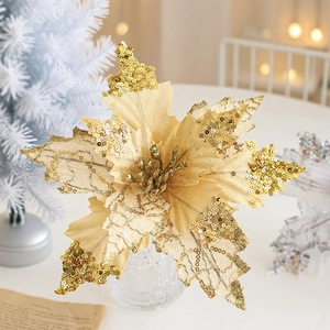 Macro detail of champagne gold velvet Christmas flower with sequins on white festive table