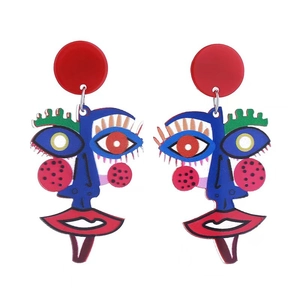 Detailed view of creative acrylic abstract face earrings with bold artistic colors