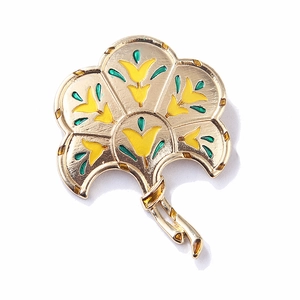 Close-up of golden fan brooch with vintage yellow and green enamel flower patterns