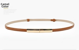 Close-up of a camel slim leather belt with a rectangular gold buckle for dresses