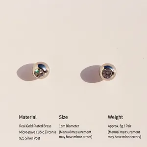 Polished silver-tone round stud earrings featuring a large cubic zirconia and 925 silver posts