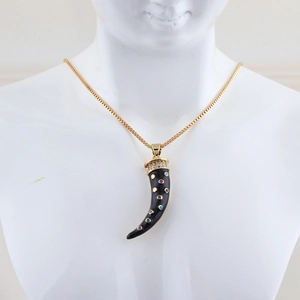 Fashion horn necklace with colorful gemstones and gold box chain on mannequin display