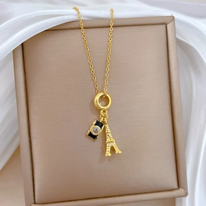 Gold titanium steel necklace with Eiffel Tower and black camera pendants with zircons