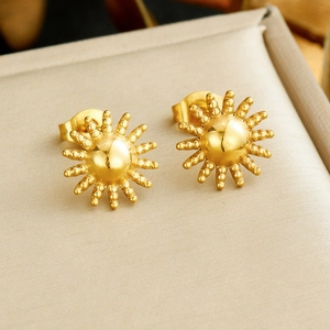 Exquisite gold sunburst stud earrings with polished beads in a premium beige jewelry box