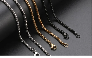 Detail of square box chains in gold, silver, and black finish with lobster clasps