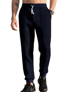 Detail of navy waffle knit joggers with white contrast drawstring and elastic waistband