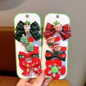 Handmade Christmas hair clip set with festive red bows, snowmen and reindeer for girls