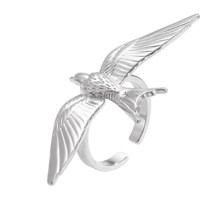 Detailed view of polished stainless steel bird ring with intricate wing feathers and open band